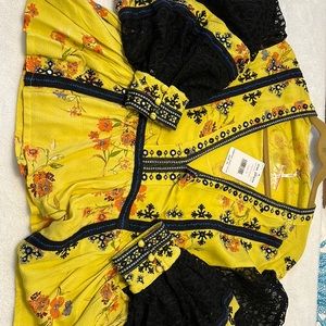 Free People blouse. NWT - black lace sleeves and embellishment.